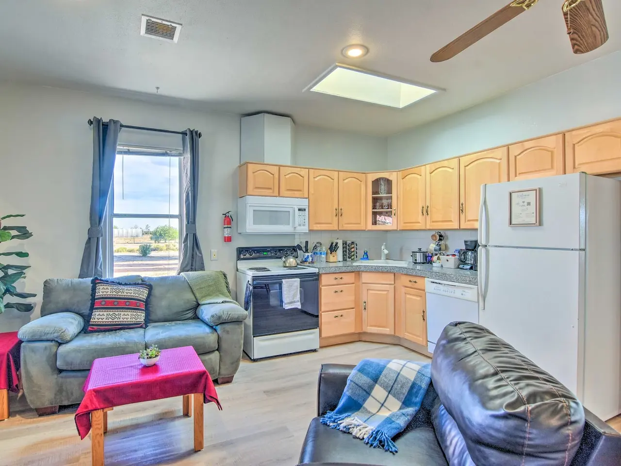 Casa 12 living room and kitchen with skylight and ceiling fan
