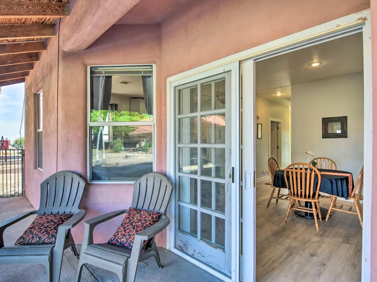 Casa 12 patio chairs beside open French doors