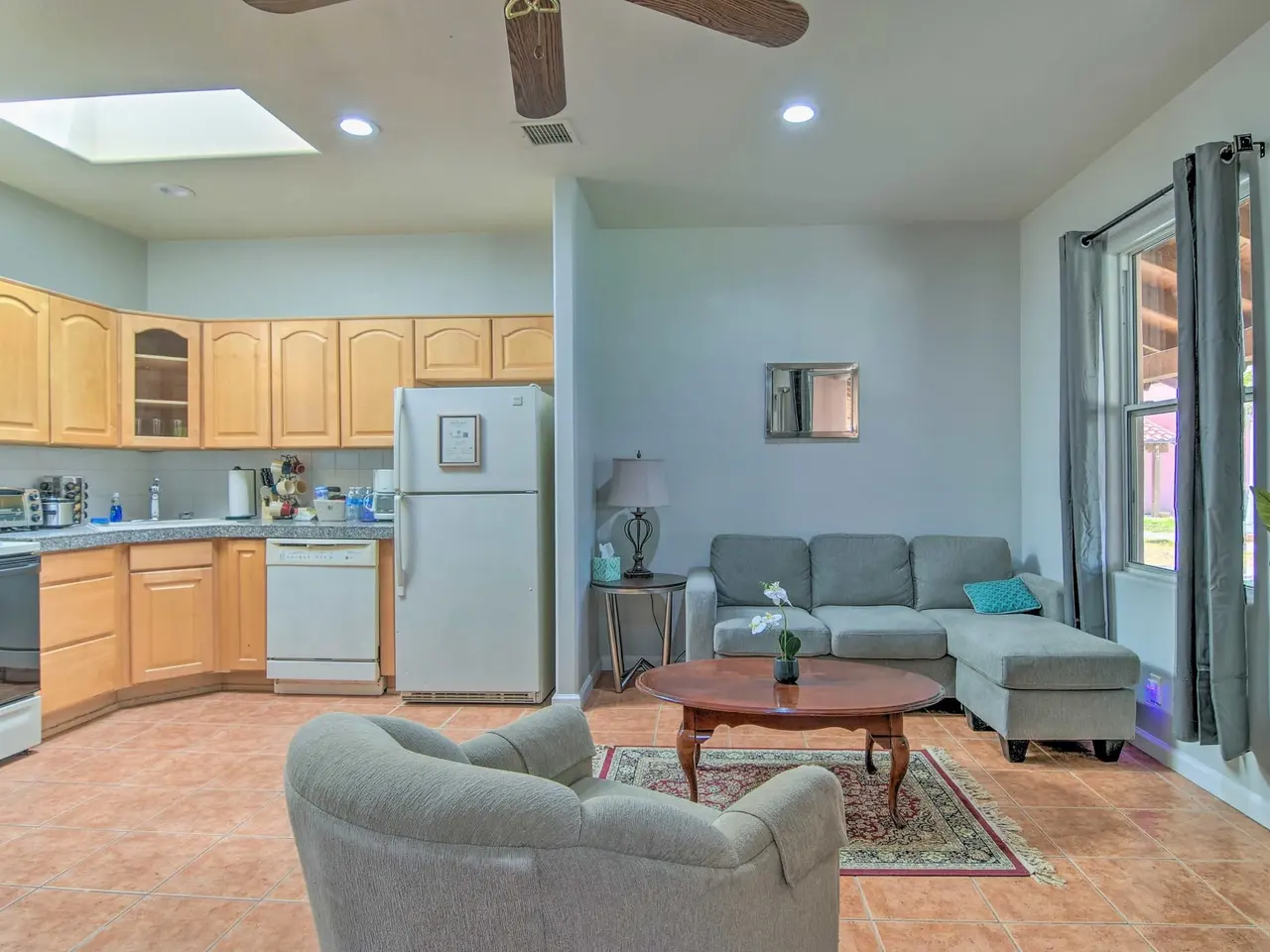 Casa 7 open living room and kitchen under a skylight