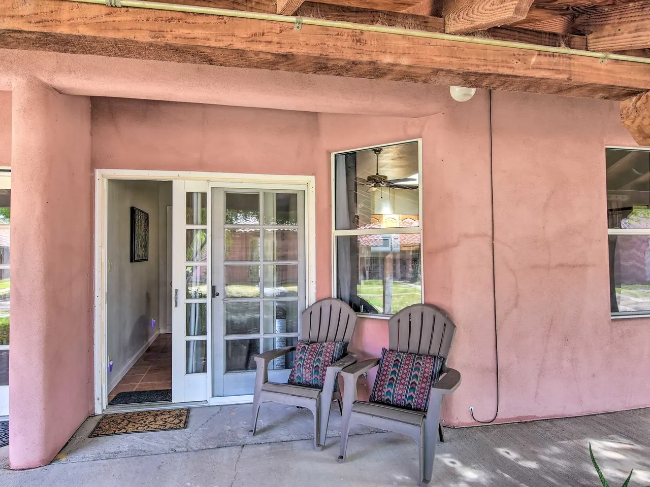 Casa 7 timber-beamed patio with two chairs