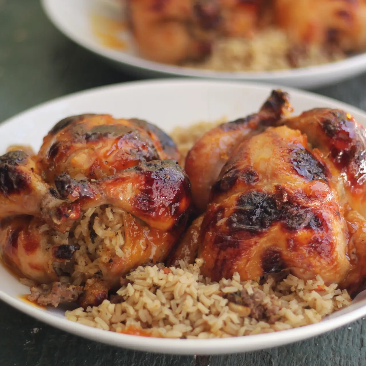 Glazed Cornish game hens on a bed of rice