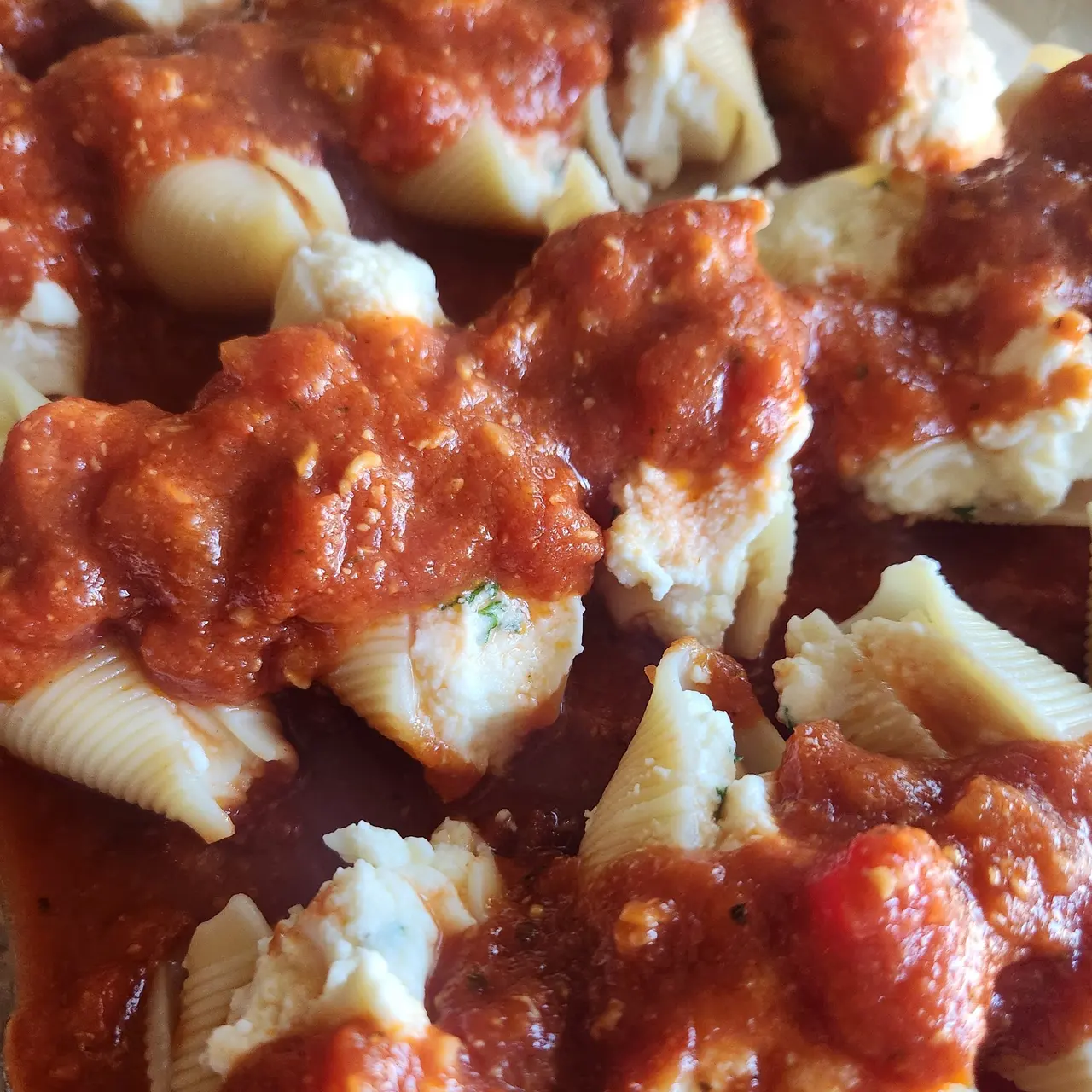 Ricotta-stuffed pasta shells in tomato sauce