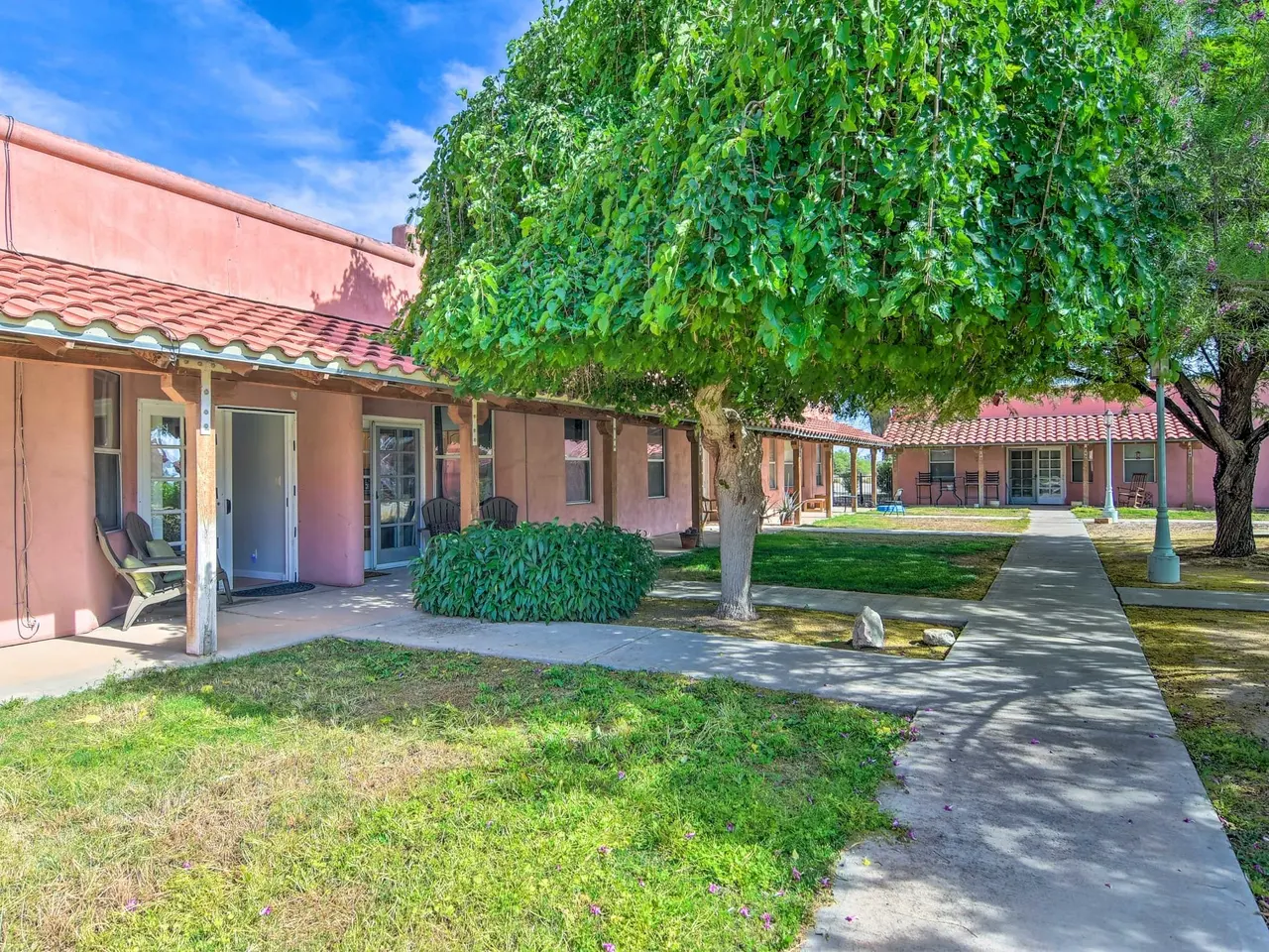 Shade tree and lawn in the courtyard between the casas
