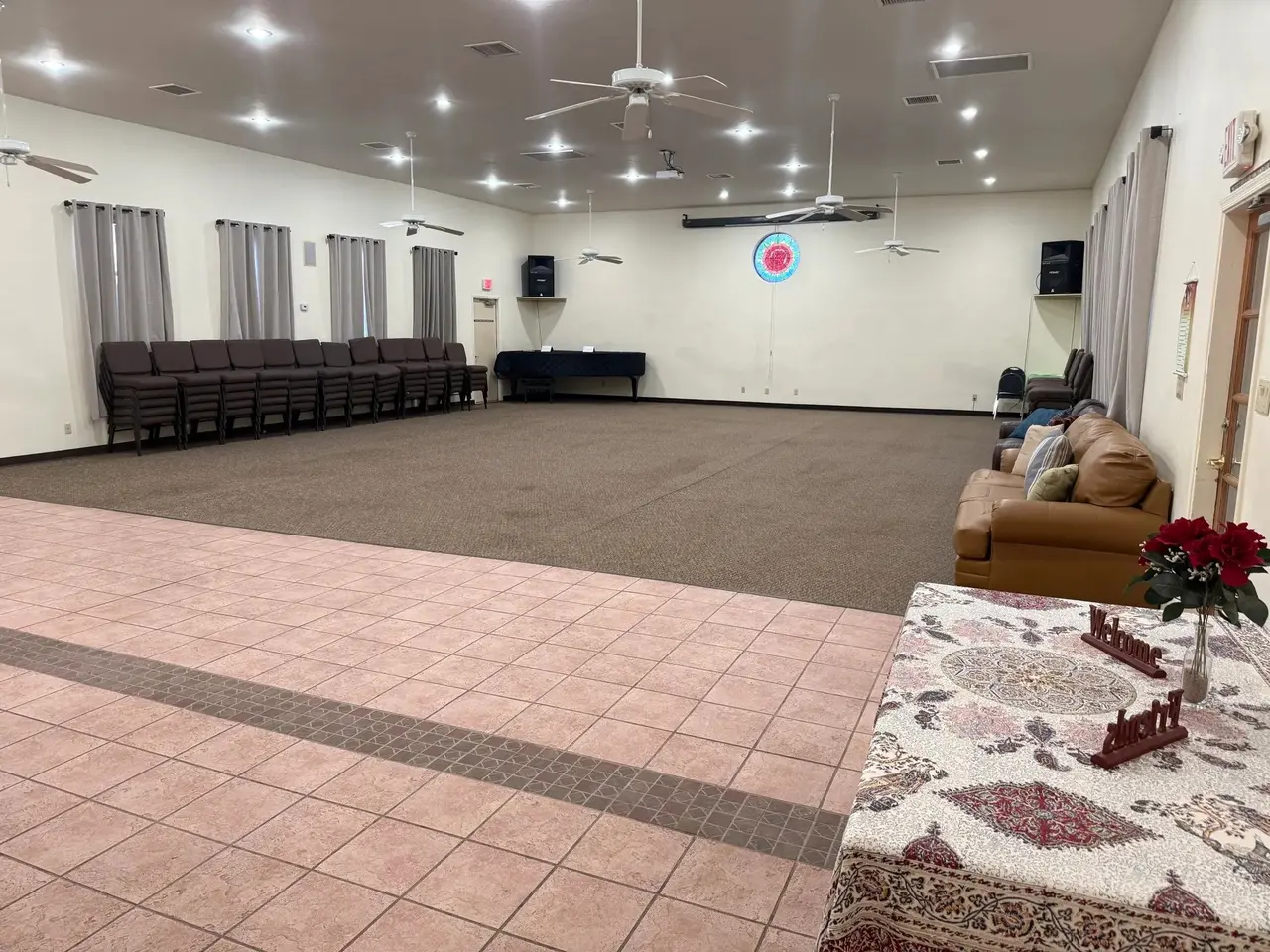 Meeting hall interior with recessed lights and ceiling fans